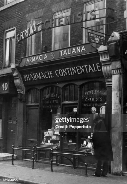 Continental chemists shop named Farmacia Italiana, owned by G. Fortuna Ltd, in Soho, London, circa 1940.