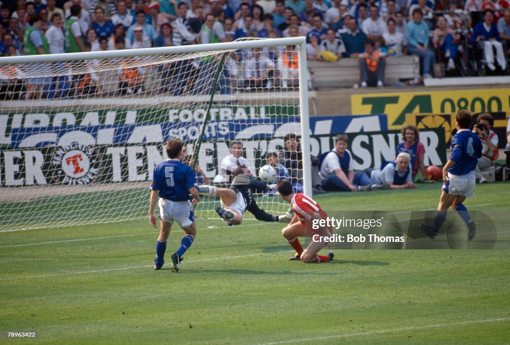 BT Sport. Football. pic: 20th May 1989. FA. Cup Final at Wembley. Evertton 2 v Liverpool 3 a.e.t. Liverpool striker Ian Rush (14) scores the winning goal past the despairing dive of Everton goalkeeper Neville Southall.