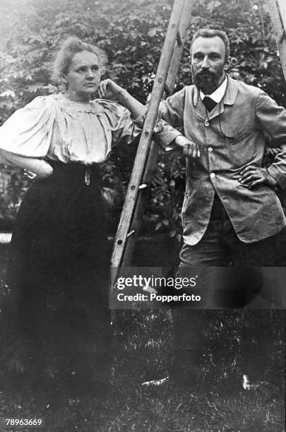 Polish born French Physicist Marie Curie , with her husband Pierre Curie in the garden of the Weights and Measures bureau at Sevres, Paris, circa...