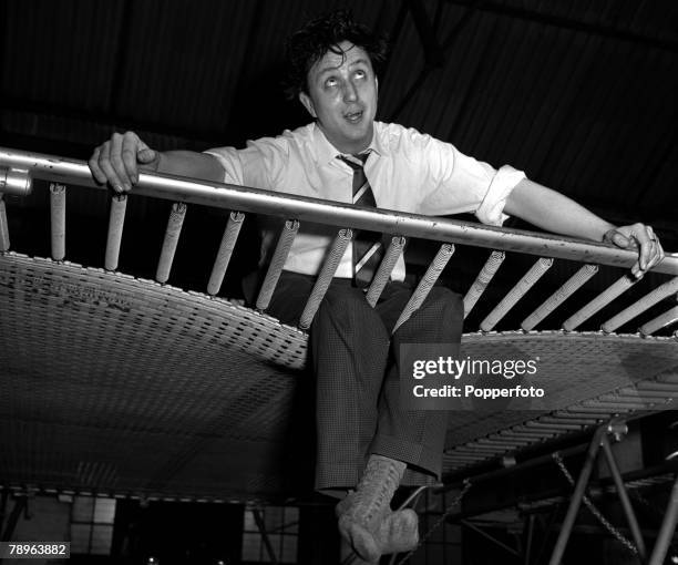 England Comedian Ken Dodd is pictured on a trampoline