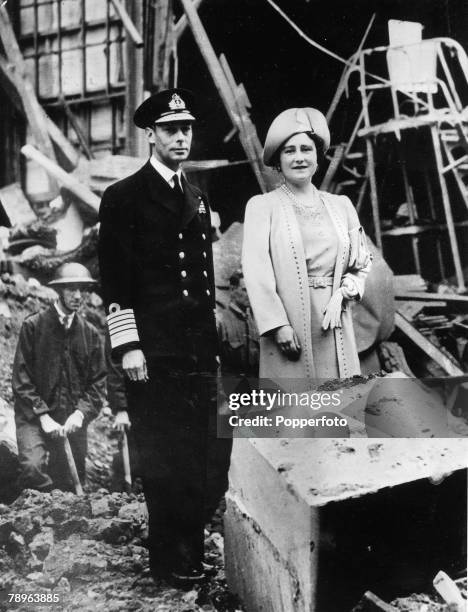 King George VI and Queen Elizabeth inspect bomb damage to Buckingham Palace following German Luftwaffe air raids over London during The Blitz and...