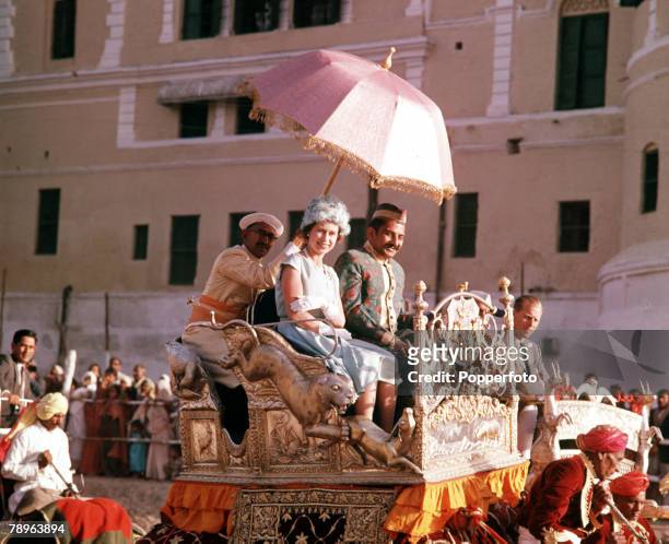 Royal Tour to India, Queen Elizabeth II is pictured taking an elephant ride in the town of Banares
