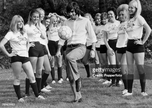 19th October 1969, Manchester United and Northern Ireland,"superstar" George Best shows his skills to the " Blinkers" girls team , George Best is...