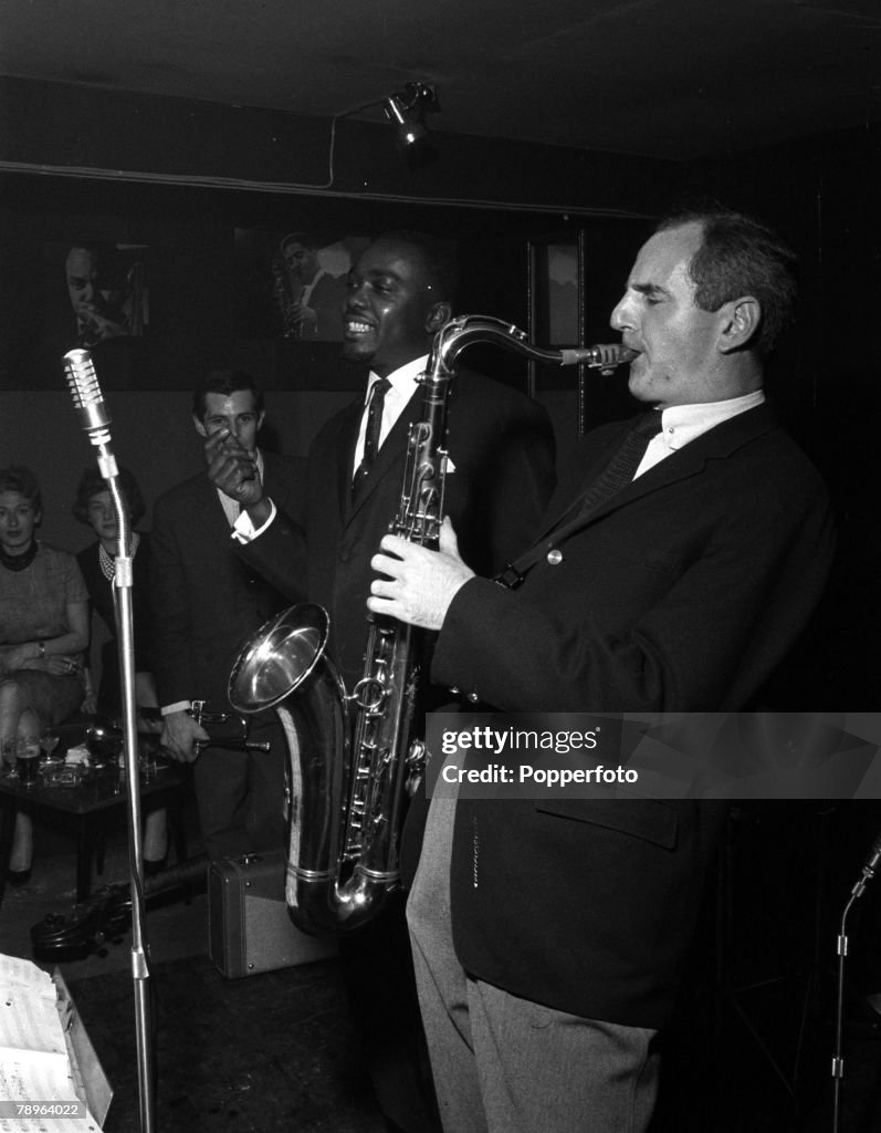 London, England. 1961. Gala opening of the Ronnie Scott Club. Jazz musician Ronnie Scott is pictured playing the saxophone.