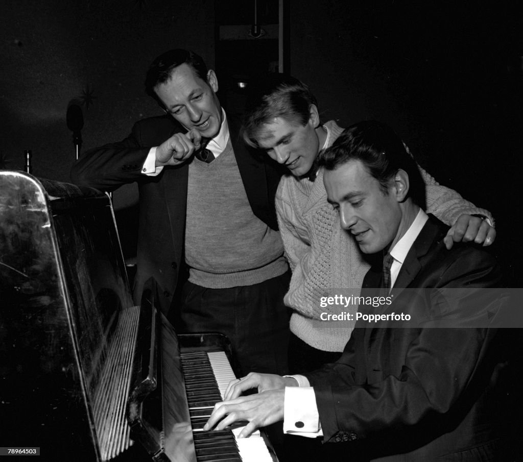 England. 1961. BBC Producer Brian Matthew (left) is pictured with singer Adam Faith (centre) and musician and producer John Barry on "Saturday Club".