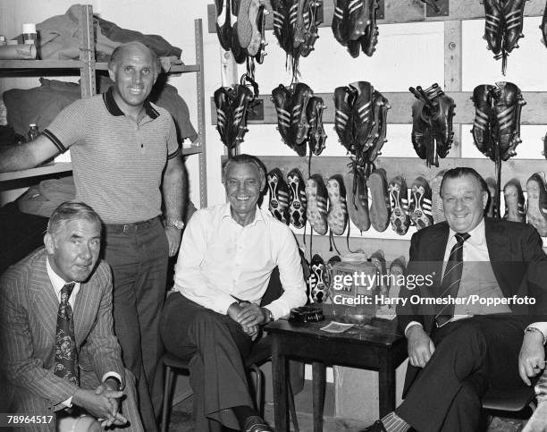 Liverpool manager Bob Paisley and his staff Tom Saunders , Ronnie Moran and Joe Fagan in the boot room at Anfield in Liverpool, England, circa 1980.