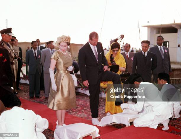 Royal Tour to Pakistan, Queen Elizabeth II and Prince Philip, the Duke of Edinburgh, are pictured at the tomb of Mohammed Ali Jinnah, the founder of...