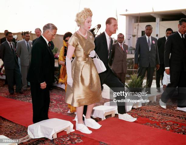 Royal Tour to Pakistan, Queen Elizabeth II and Prince Philip, the Duke of Edinburgh, are pictured at the tomb of Mohammed Ali Jinnah, the founder of...