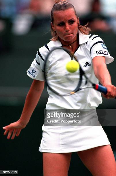 Tennis, Wimbledon Lawn Tennis Championships, Women+s Singles Second Round, 28th June 2000, France+s Anne-Gaelle Sidot plays a backhand during her...
