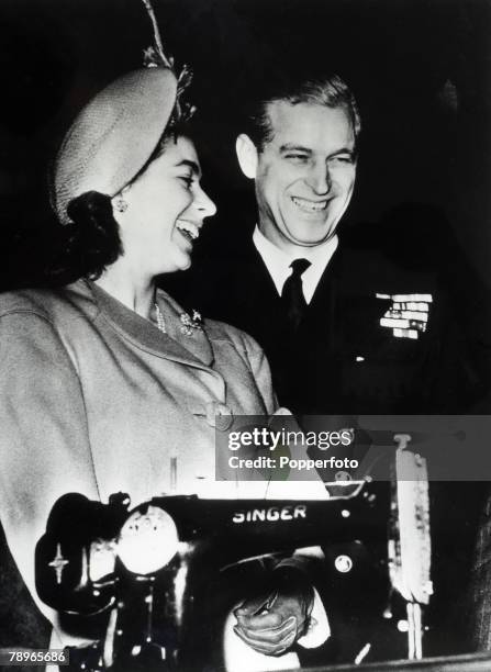 British Royalty, Clydebank, Scotland, 30th October 1947, Princess Elizabeth and Lieutenant Philip Mountbatten enjoy a joke over a Singer Sowing...