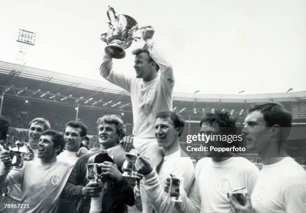 2nd March 1968, 1968 League Cup Final at Wembley, Leeds United 1 v Arsenal 0, Leeds United captain Billy Bremner is chaired as he holds the trophy...