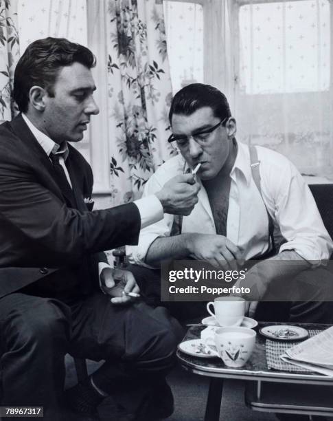 Crime, London, England, Circa 1960's, The Kray Twins, Reg and Ronnie Kray smoking a cigarette and drinking tea