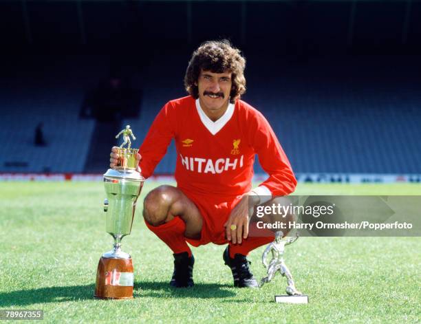 Liverpool footballer Terry McDermott with the PFA Players' Player of the Year and the Football Writers' Association Footballer of the Year trophies...