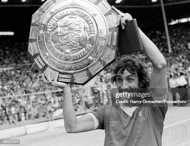 Terry McDermott of Liverpool celebrates with the trophy after the FA Charity Shield between Liverpool and West Ham United at Wembley Stadium on...