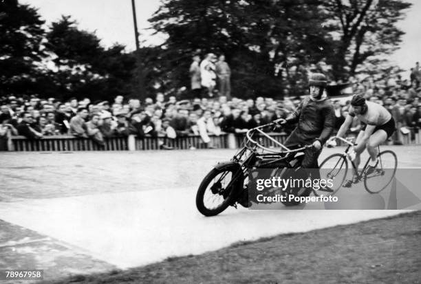 Cycle racing at Herne Hill velodrome in south London, showing motor cycle pacer and cyclist, circa 1945. Herne Hill velodrome would host the track...