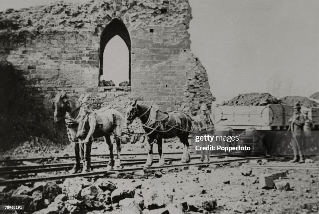 Social History. pic: circa 1870's. England, Northamptonshire, Northampton. The demolition of Northampton Castle with workmen using horses and cart to remove the rubble.