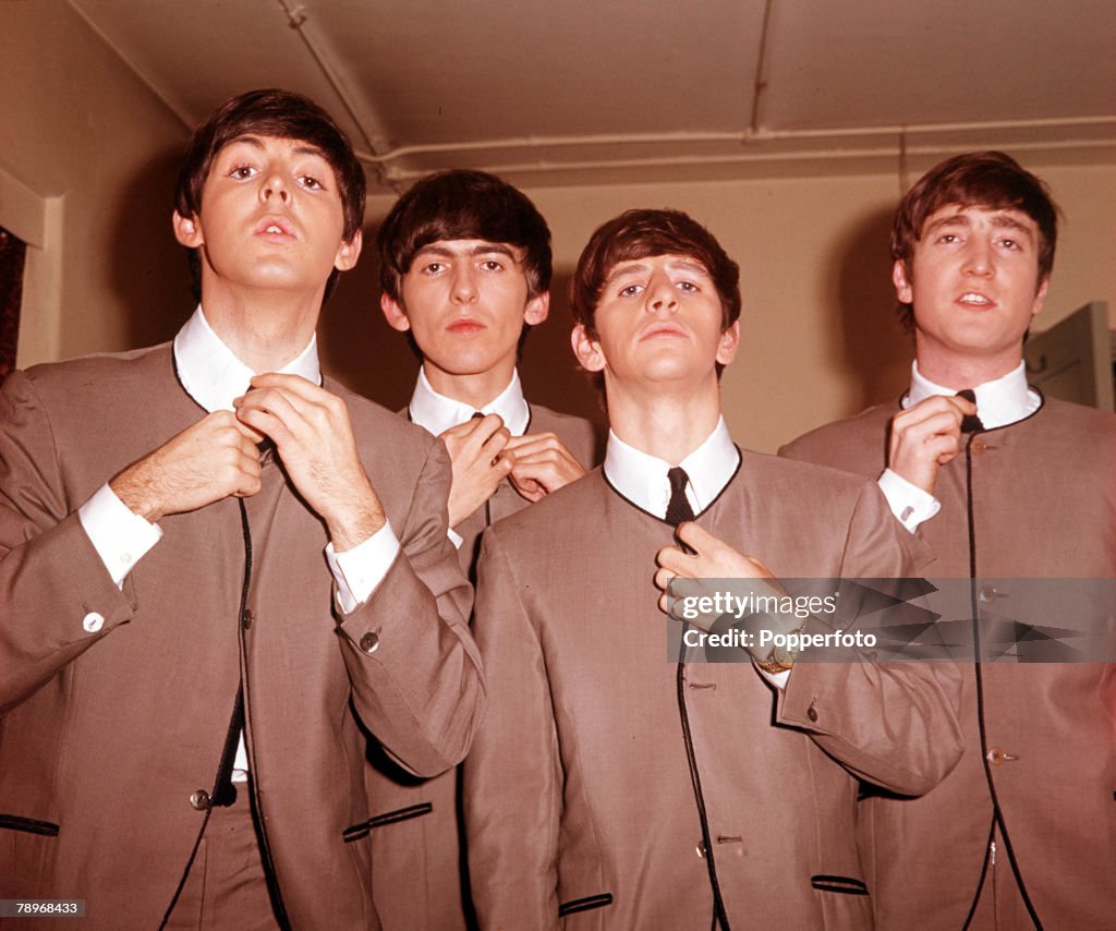 The Book. Volume 1: Page 12, Picture 8. 1963. A picture of the legendary English rock group "The Beatles". L-R: Paul McCartney, George Harrison, Ringo Starr, and John Lennon.