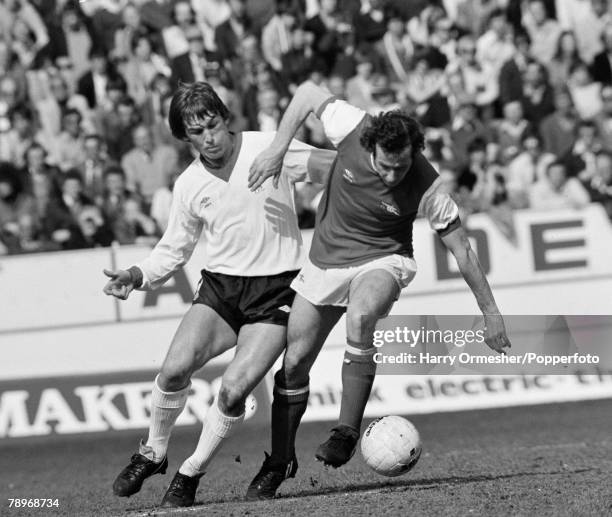 Liam Brady of Arsenal holds off the challenge from Kenny Dalglish of Liverpool during the FA Cup Semi Final at Hillsborough Stadium on April 12, 1980...