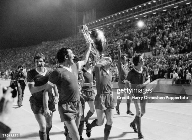Liverpool FC players celebrate with the trophy after the European Cup Final between Liverpool and Borussia Monchengladbach at the Stadio Olimpico on...