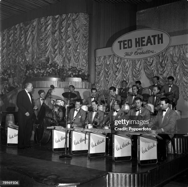 London, England Bandleader Ted Heath is pictured making the film "It's a Great Life" at the Hammersmith Palais
