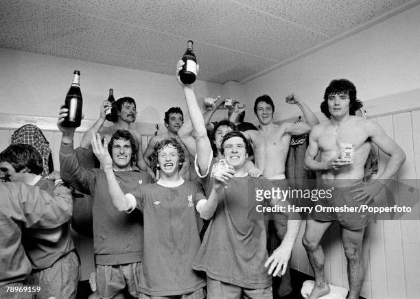 Liverpool players celebrate in the changing rooms with bottles of champagne after winning the League Championship following the Football League...