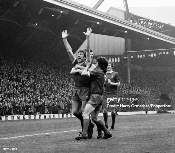 Emlyn Hughes of Liverpool celebrates after scoring with teammates including Kevin Keegan during the Football League Division One match between...