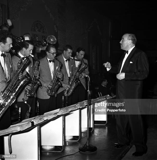 London, England Bandleader Ted Heath is pictured making the film "It's a Great Life" at the Hammersmith Palais