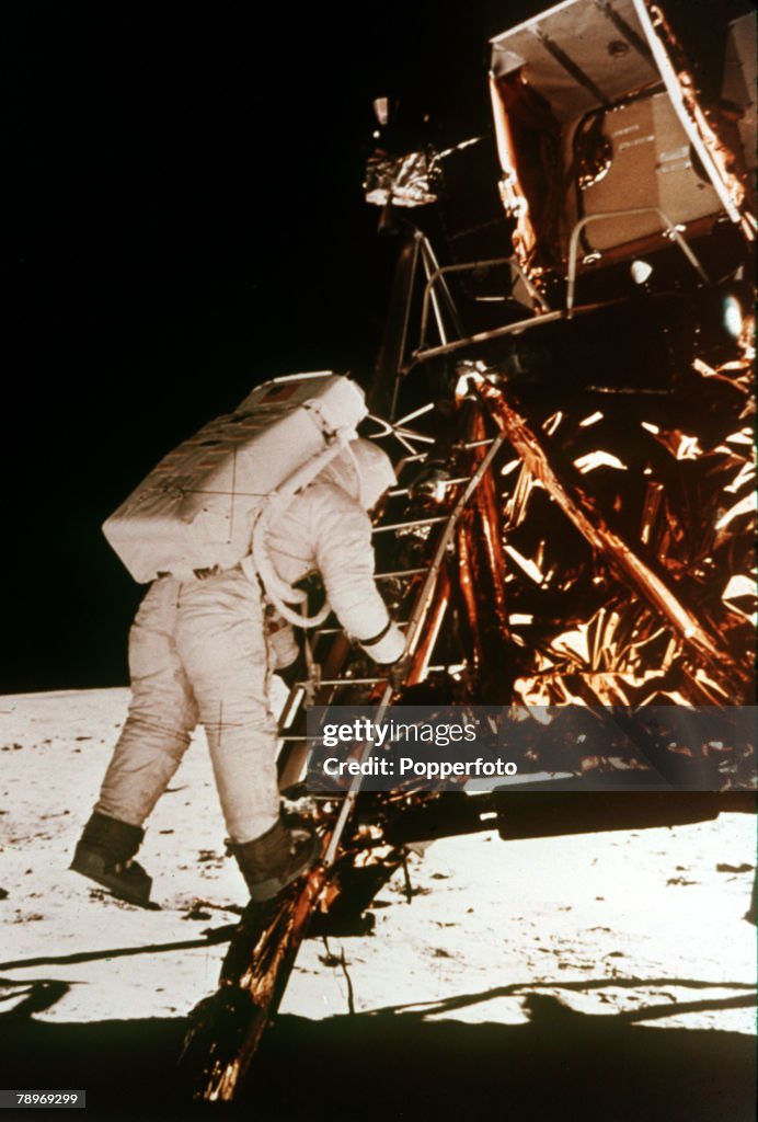 Space Exploration. Apollo 11. Astronaut Edwin "Buzz" Aldrin descends the steps of the lunar module to the moon's surface on the 20th July 1969 to become the 2nd man to walk on the moon, following in the footsteps of Neil Armstrong. This photograph was tak