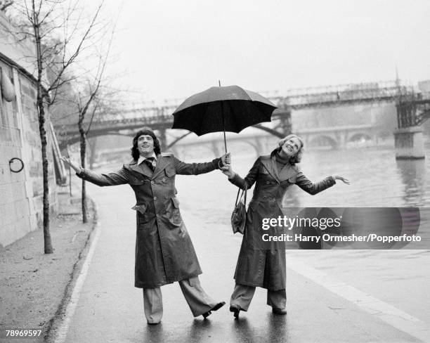 Liverpool FC and England footballer Kevin Keegan and his wife Jean enjoying their holiday despite the rain in Paris, France, circa November 1976.