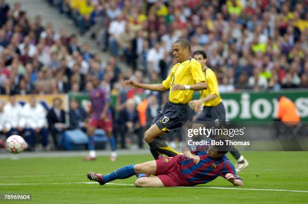 Arsenal's Gilberto Silva is tackled by Barcelona's Mark van Bommel during action in the 2006 UEFA Champions League Final between Barcelona and...