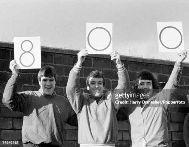 Liverpool footballers Emlyn Hughes and Kevin Keegan celebrate teammate Ian Callaghan's 800th professional match for Liverpool, at Melwood in...