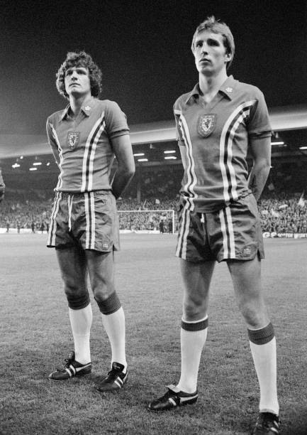 Kenny Dalglish and Lou Macari of Scotland line up before the 1978 World Cup Qualification Group 7 match between Wales and Scotland at Anfield on...