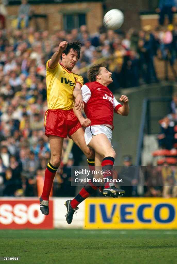 BT Sport. Football. pic: April 1985. Division 1. Watford 2 v Arsenal 1. Watford's Steve Sims outjumps Arsenal's John Hawley.