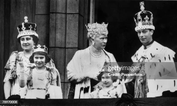 King George VI and Queen Elizabeth with Queen Mary and, at the front, their children Princess Elizabeth and Princess Margaret on the balcony at...
