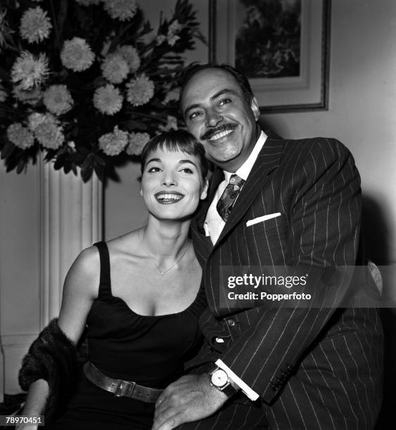 England Actress Elsa Martinelli is pictured with actor Pedro Armendariz at a press reception at the Mayfair Hotel for the film "Manuela"