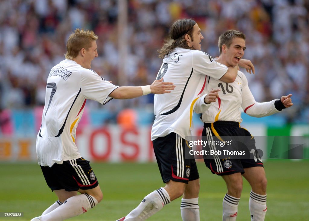BT Sport. Football. 2006 FIFA World Cup. Munich. 9th June 2006. Germany 4 v Costa Rica 2. Germany's Bastian Schweinsteiger, left, and Torsten Frings rush to conratulate Philipp Lahm, right, who had scored the 1st German goal.