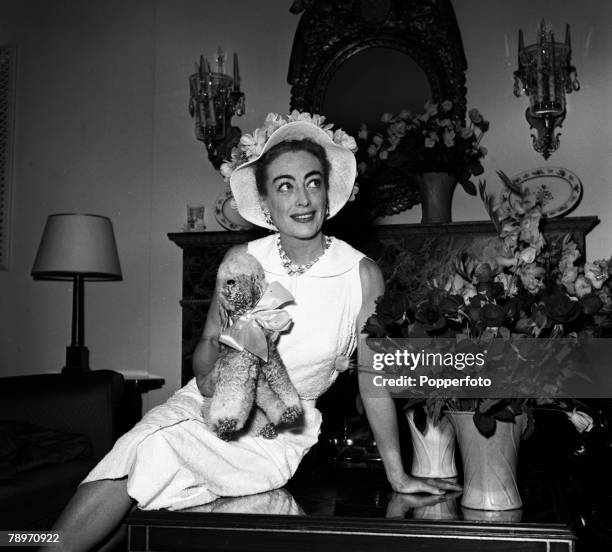 London, England American actress Joan Crawford is pictured at a press reception at the Savoy Hotel