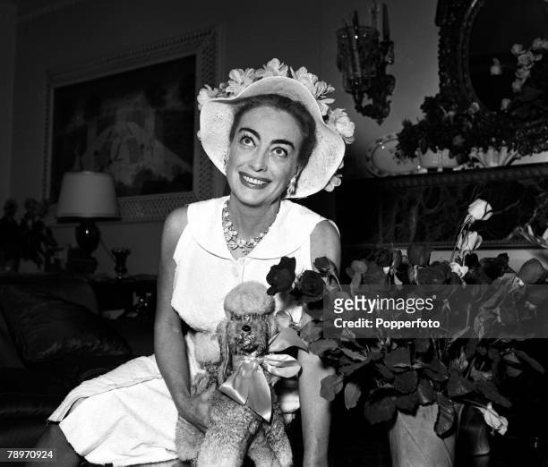 London, England American actress Joan Crawford is pictured at a press reception at the Savoy Hotel