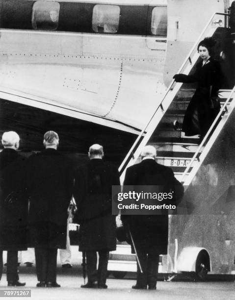 Queen Elizabeth II steps from her plane on her at arrival at London Airport after being recalled from Kenya following the death of her father King...