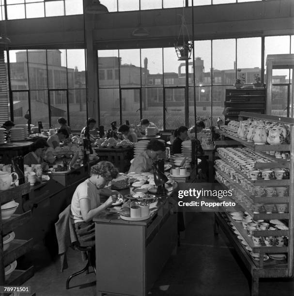 England At the Wedgewood works near Stoke-on-Trent, colours are painted onto the plates by hand