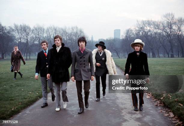 The Rolling Stones walking together for a press call in Green Park, London on 11th January 1967. From left to right: Charlie Watts, Mick Jagger, Bill...