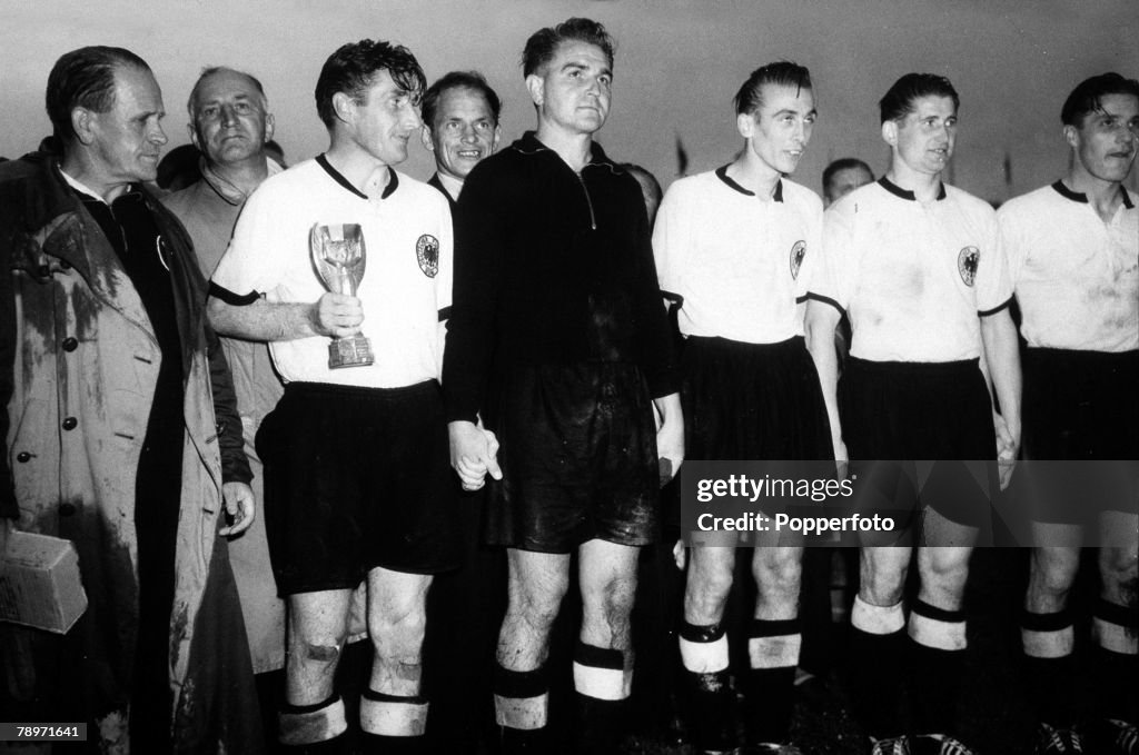Football. 1954 World Cup Finals. Berne, Switzerland.5th July 1954. West Germany 3 v Hungary 2. West Germany captain Fritz Walter with the Jules Rimet trophy and the team alongside.