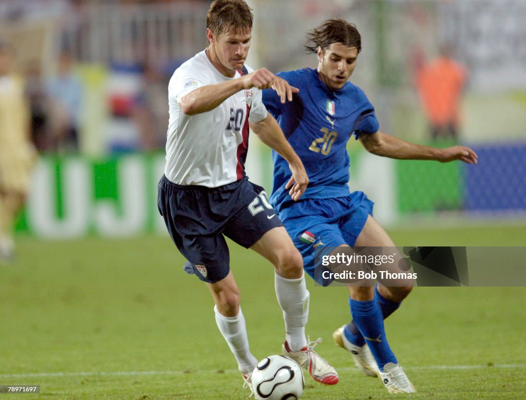 BT Sport. Football. FIFA World Cup. Kaiserslautern. 17th June 2006. Italy 1 v USA 1. USA's Brian McBride is challenged by Italy's Simone Perrotta, right.