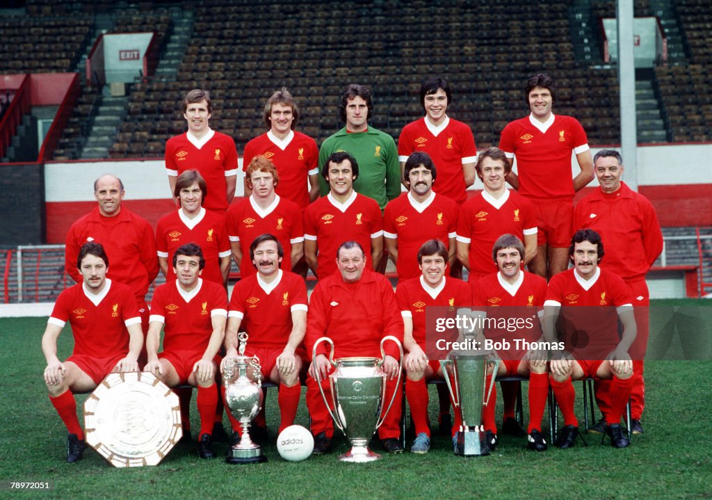 Sport. Football. Liverpool FC Team Group 1977-78 Season. The Liverpool team pose together for a group photograph with the League Championship, European Cup and Manager of the Year trophies. Back Row L-R: Joey Jones, Phil Thompson, Ray Clemence, Alan Hanse