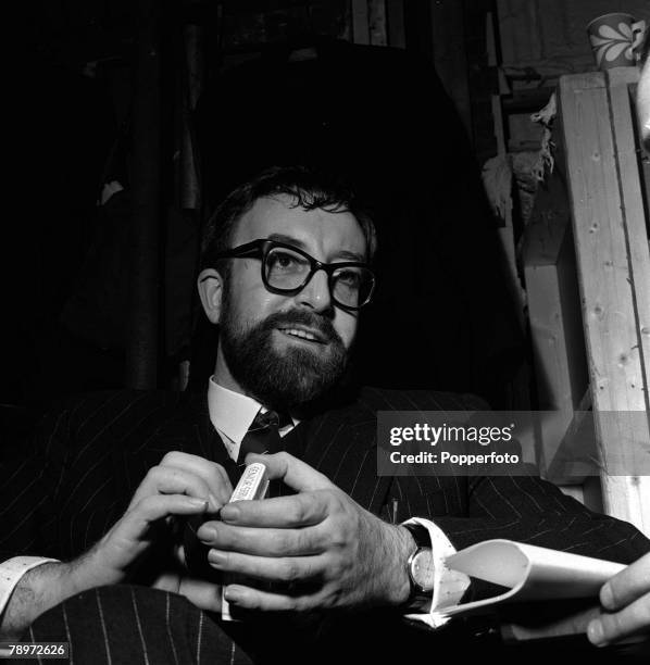 Comedy actor Peter Sellars wearing glasses and sporting a beard during filming at Boreham Wood, 1960