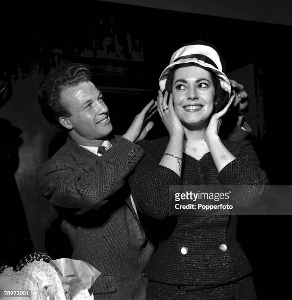 Actress Susan Kohner is presented with a hat by Luton Town's right winger Billy Bingham