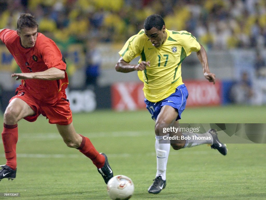 BT Football. 2002 FIFA World Cup Finals. Kobe, Japan. 17th June 2002. Brazil 2 v Belgium 0. Denilson of Brazil with Belgium's Timmy Simons.