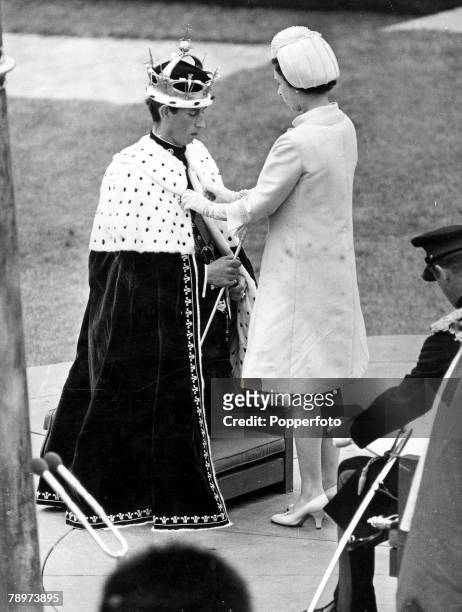 1st July 1969, A scene showing the moment when Queen Elizabeth II fastened the ermine mantle around the shoulders of Prince Charles at Caerarvon...