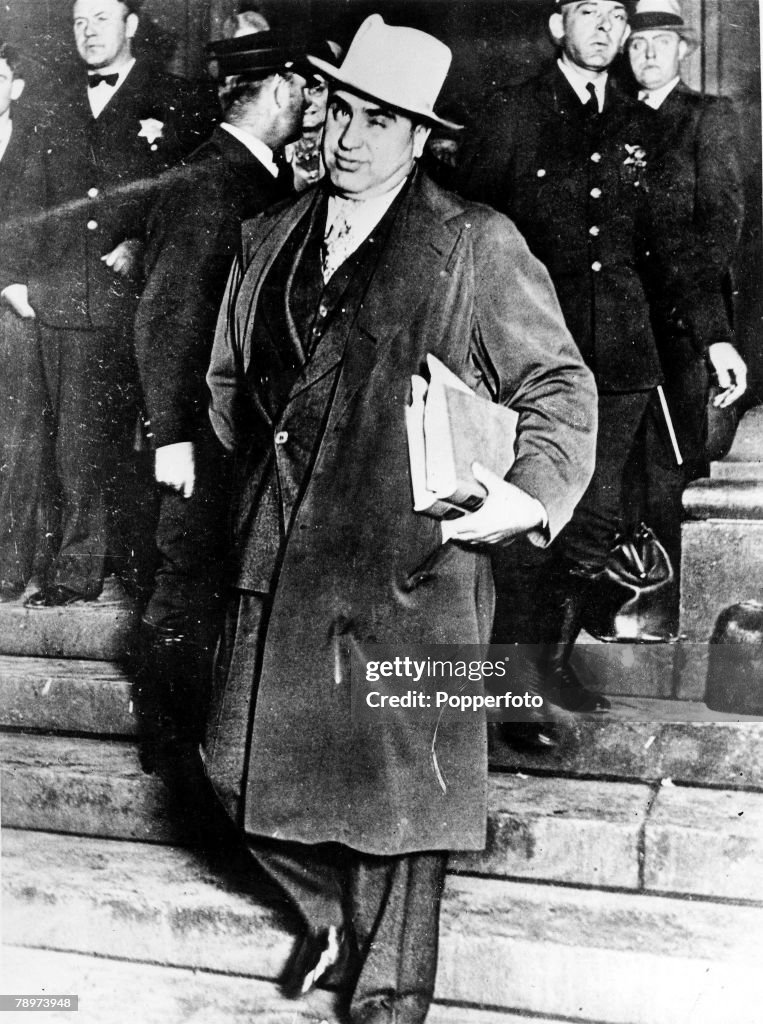 May 1932. Chicago, USA. American prohibition-time gangster Al Capone winks to the camera before facing sentence for Federal Income Tax Evasion. Capone was sentenced to 11 years in prison and a fine of ?10,000.