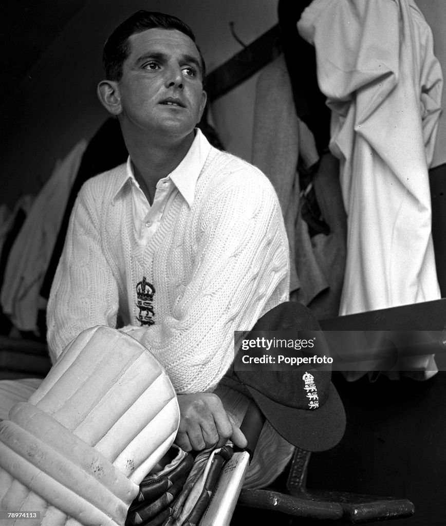 1951. England and Gloucester cricketer Tom Graveney is pictured padded up in the dressing room.